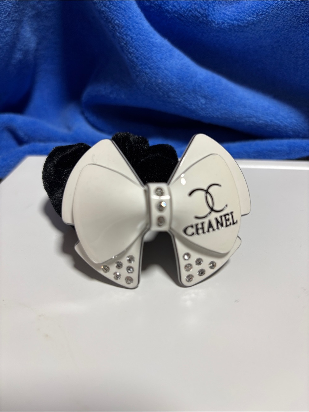 CHANEL White Bow Hair Tie with Black Elastic and Crystal Accents
